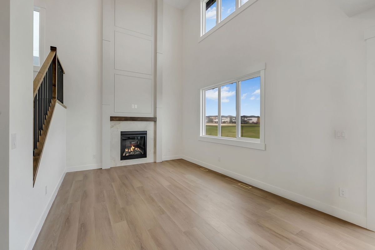 Living room with a fireplace and feature wall